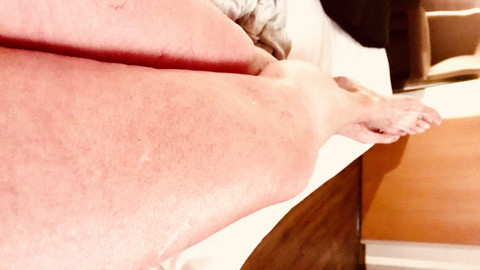 Legs stretched out on a lounger